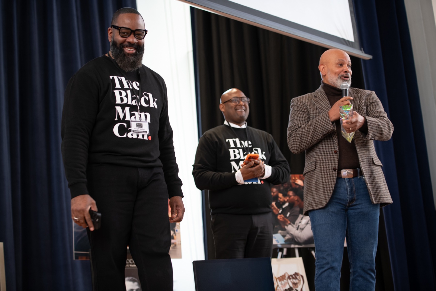 Three educators on stage at the 2026 Summit
