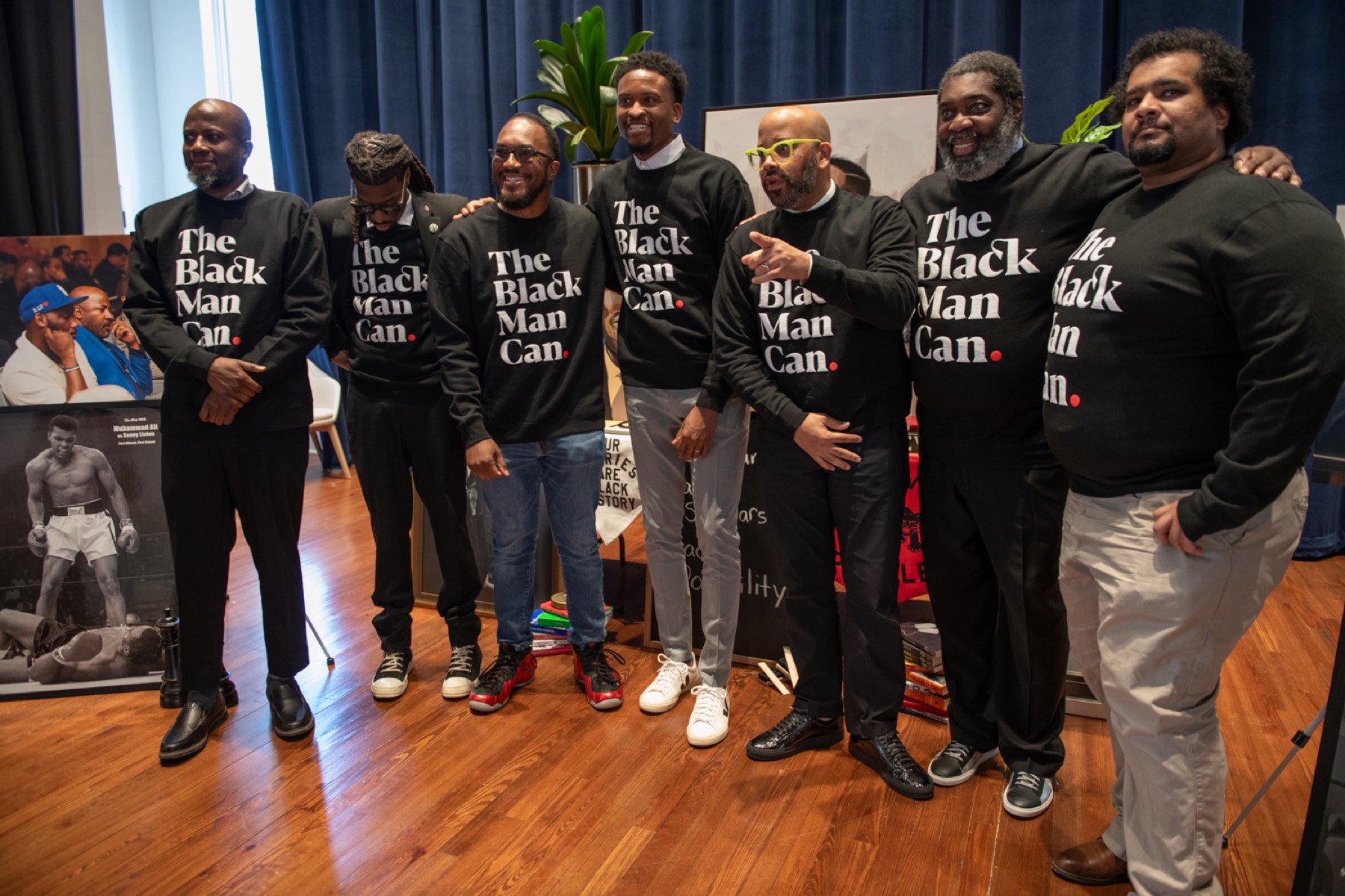 Black male educators standing together on stage at the 2026 Summit